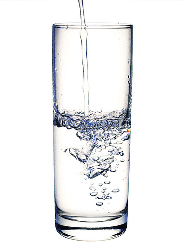 glasses of water cartoon. glass half full.